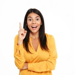 Picture of amazing happy young lady in yellow shirt standing isolated over white background have an idea.